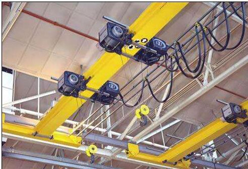 One easy way to boost efficiency is by using an overhead bridge crane.